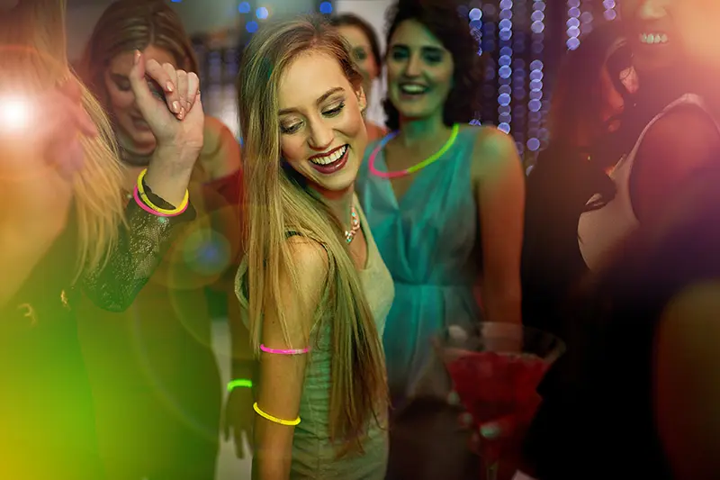 Beautiful young woman dancing in a nightclub
