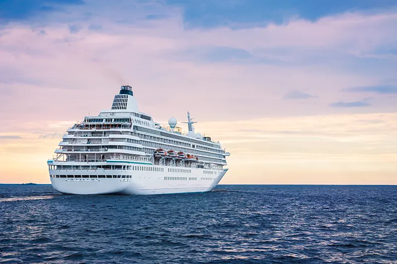 Big cruise ship in the sea at sunset