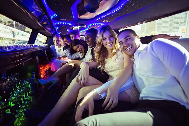 Happy friends in a limousine