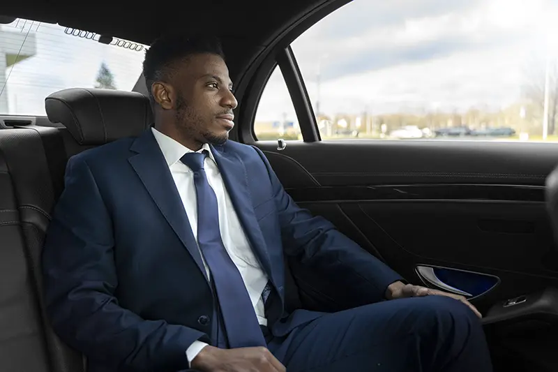 Man sitting in the backseat of a car